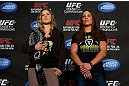 ANAHEIM, CA - FEBRUARY 21:  (L-R) Opponents Ronda Rousey and Liz Carmouche pose for photos during a UFC pre-fight press conference at Honda Center on February 21, 2013 in Anaheim, California.  (Photo by Josh Hedges/Zuffa LLC/Zuffa LLC via Getty Images)