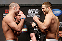 ANAHEIM, CA - FEBRUARY 22:  (L-R) Opponents Kenny Robertson and Brock Jardine face off during the UFC 157 weigh-in at Honda Center on February 22, 2013 in Anaheim, California.  (Photo by Josh Hedges/Zuffa LLC/Zuffa LLC via Getty Images)