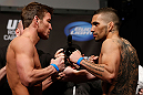 ANAHEIM, CA - FEBRUARY 22:  (L-R) Opponents Sam Stout and Caros Fodor face off during the UFC 157 weigh-in at Honda Center on February 22, 2013 in Anaheim, California.  (Photo by Josh Hedges/Zuffa LLC/Zuffa LLC via Getty Images)