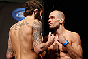 ANAHEIM, CA - FEBRUARY 22:  (L-R) Opponents Michael Chiesa and Anton Kuivanen face off during the UFC 157 weigh-in at Honda Center on February 22, 2013 in Anaheim, California.  (Photo by Josh Hedges/Zuffa LLC/Zuffa LLC via Getty Images)