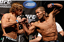 ANAHEIM, CA - FEBRUARY 22:  (L-R) Opponents Urijah Faber and Ivan Menjivar face off during the UFC 157 weigh-in at Honda Center on February 22, 2013 in Anaheim, California.  (Photo by Josh Hedges/Zuffa LLC/Zuffa LLC via Getty Images)