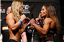 ANAHEIM, CA - FEBRUARY 22:  (L-R) Opponents Ronda Rousey and Liz Carmouche face off during the UFC 157 weigh-in at Honda Center on February 22, 2013 in Anaheim, California.  (Photo by Josh Hedges/Zuffa LLC/Zuffa LLC via Getty Images)