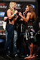 ANAHEIM, CA - FEBRUARY 22:  (L-R) Opponents Ronda Rousey and Liz Carmouche face off during the UFC 157 weigh-in at Honda Center on February 22, 2013 in Anaheim, California.  (Photo by Josh Hedges/Zuffa LLC/Zuffa LLC via Getty Images)