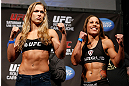 ANAHEIM, CA - FEBRUARY 22:  (L-R) Opponents Ronda Rousey and Liz Carmouche pose for photos during the UFC 157 weigh-in at Honda Center on February 22, 2013 in Anaheim, California.  (Photo by Josh Hedges/Zuffa LLC/Zuffa LLC via Getty Images)