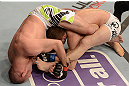 ANAHEIM, CA - FEBRUARY 23:  Kenny Robertson (left) attempts to submit Brock Jardine in their welterweight bout during UFC 157 at Honda Center on February 23, 2013 in Anaheim, California.  (Photo by Donald Miralle/Zuffa LLC/Zuffa LLC via Getty Images) *** Local Caption *** Kenny Robertson; Brock Jardine
