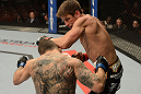 ANAHEIM, CA - FEBRUARY 23:  Sam Stout (right) punches Caros Fodor in their lightweight bout during UFC 157 at Honda Center on February 23, 2013 in Anaheim, California.  (Photo by Donald Miralle/Zuffa LLC/Zuffa LLC via Getty Images) *** Local Caption *** Sam Stout; Caros Fodor