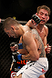 ANAHEIM, CA - FEBRUARY 23:  (R-L) Sam Stout punches Caros Fodor in their lightweight bout during UFC 157 at Honda Center on February 23, 2013 in Anaheim, California.  (Photo by Josh Hedges/Zuffa LLC/Zuffa LLC via Getty Images) *** Local Caption *** Sam Stout; Caros Fodor