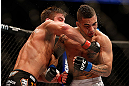 ANAHEIM, CA - FEBRUARY 23:  (L-R) Sam Stout punches Caros Fodor in their lightweight bout during UFC 157 at Honda Center on February 23, 2013 in Anaheim, California.  (Photo by Josh Hedges/Zuffa LLC/Zuffa LLC via Getty Images) *** Local Caption *** Sam Stout; Caros Fodor