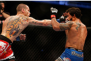 ANAHEIM, CA - FEBRUARY 23:  Matt Grice (left) punches Dennis Bermudez in their featherweight bout during UFC 157 at Honda Center on February 23, 2013 in Anaheim, California.  (Photo by Josh Hedges/Zuffa LLC/Zuffa LLC via Getty Images) *** Local Caption *** Dennis Bermudez; Matt Grice
