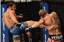 ANAHEIM, CA - FEBRUARY 23:  (L-R) Dennis Bermudez (left) kicks Matt Grice in their featherweight bout during UFC 157 at Honda Center on February 23, 2013 in Anaheim, California.  (Photo by Donald Miralle/Zuffa LLC/Zuffa LLC via Getty Images) *** Local Caption *** Dennis Bermudez; Matt Grice