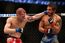 ANAHEIM, CA - FEBRUARY 23:  (L-R) Matt Grice punches Dennis Bermudez in their featherweight bout during UFC 157 at Honda Center on February 23, 2013 in Anaheim, California.  (Photo by Josh Hedges/Zuffa LLC/Zuffa LLC via Getty Images) *** Local Caption *** Dennis Bermudez; Matt Grice