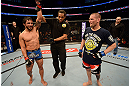 ANAHEIM, CA - FEBRUARY 23:  Dennis Bermudez (left) reacts to his victory over Matt Grice (right) in their featherweight bout during UFC 157 at Honda Center on February 23, 2013 in Anaheim, California.  (Photo by Donald Miralle/Zuffa LLC/Zuffa LLC via Getty Images) *** Local Caption *** Dennis Bermudez; Matt Grice