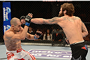 ANAHEIM, CA - FEBRUARY 23:  (R-L) Michael Chiesa punches Anton Kuivanen in their lightweight bout during UFC 157 at Honda Center on February 23, 2013 in Anaheim, California.  (Photo by Donald Miralle/Zuffa LLC/Zuffa LLC via Getty Images) *** Local Caption *** Michael Chiesa; Anton Kuivanen