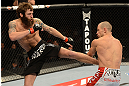 ANAHEIM, CA - FEBRUARY 23:  (L-R) Michael Chiesa kicks Anton Kuivanen in their lightweight bout during UFC 157 at Honda Center on February 23, 2013 in Anaheim, California.  (Photo by Donald Miralle/Zuffa LLC/Zuffa LLC via Getty Images) *** Local Caption *** Michael Chiesa; Anton Kuivanen
