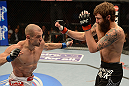 ANAHEIM, CA - FEBRUARY 23:  (L-R) Anton Kuivanen punches Michael Chiesa in their lightweight bout during UFC 157 at Honda Center on February 23, 2013 in Anaheim, California.  (Photo by Donald Miralle/Zuffa LLC/Zuffa LLC via Getty Images) *** Local Caption *** Michael Chiesa; Anton Kuivanen