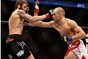 ANAHEIM, CA - FEBRUARY 23:  (R-L) Anton Kuivanen punches Michael Chiesa in their lightweight bout during UFC 157 at Honda Center on February 23, 2013 in Anaheim, California.  (Photo by Josh Hedges/Zuffa LLC/Zuffa LLC via Getty Images) *** Local Caption *** Michael Chiesa; Anton Kuivanen