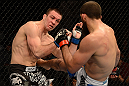 ANAHEIM, CA - FEBRUARY 23:  (R-L) Court McGee kicks Josh Neer in their welterweight bout during UFC 157 at Honda Center on February 23, 2013 in Anaheim, California.  (Photo by Donald Miralle/Zuffa LLC/Zuffa LLC via Getty Images) *** Local Caption *** Court McGee; Josh Neer