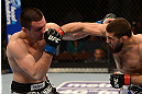 ANAHEIM, CA - FEBRUARY 23:  (R-L) Court McGee punches Josh Neer in their welterweight bout during UFC 157 at Honda Center on February 23, 2013 in Anaheim, California.  (Photo by Donald Miralle/Zuffa LLC/Zuffa LLC via Getty Images) *** Local Caption *** Court McGee; Josh Neer
