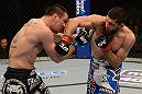 ANAHEIM, CA - FEBRUARY 23:  (R-L) Court McGee punches Josh Neer in their welterweight bout during UFC 157 at Honda Center on February 23, 2013 in Anaheim, California.  (Photo by Donald Miralle/Zuffa LLC/Zuffa LLC via Getty Images) *** Local Caption *** Court McGee; Josh Neer