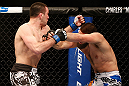 ANAHEIM, CA - FEBRUARY 23:  (L-R) Josh Neer punches Court McGee in their welterweight bout during UFC 157 at Honda Center on February 23, 2013 in Anaheim, California.  (Photo by Josh Hedges/Zuffa LLC/Zuffa LLC via Getty Images) *** Local Caption *** Court McGee; Josh Neer