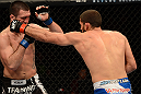 ANAHEIM, CA - FEBRUARY 23:  (R-L) Court McGee punches Josh Neer in their welterweight bout during UFC 157 at Honda Center on February 23, 2013 in Anaheim, California.  (Photo by Donald Miralle/Zuffa LLC/Zuffa LLC via Getty Images) *** Local Caption *** Court McGee; Josh Neer