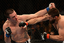 ANAHEIM, CA - FEBRUARY 23:  (L-R) Josh Neer punches Court McGee in their welterweight bout during UFC 157 at Honda Center on February 23, 2013 in Anaheim, California.  (Photo by Donald Miralle/Zuffa LLC/Zuffa LLC via Getty Images) *** Local Caption *** Court McGee; Josh Neer