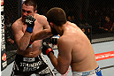 ANAHEIM, CA - FEBRUARY 23:  (R-L) Court McGee punches Josh Neer in their welterweight bout during UFC 157 at Honda Center on February 23, 2013 in Anaheim, California.  (Photo by Donald Miralle/Zuffa LLC/Zuffa LLC via Getty Images) *** Local Caption *** Court McGee; Josh Neer