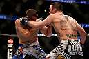 ANAHEIM, CA - FEBRUARY 23:  (R-L) Josh Neer punches Court McGee in their welterweight bout during UFC 157 at Honda Center on February 23, 2013 in Anaheim, California.  (Photo by Josh Hedges/Zuffa LLC/Zuffa LLC via Getty Images) *** Local Caption *** Court McGee; Josh Neer