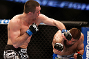 ANAHEIM, CA - FEBRUARY 23:  (L-R) Josh Neer punches Court McGee in their welterweight bout during UFC 157 at Honda Center on February 23, 2013 in Anaheim, California.  (Photo by Josh Hedges/Zuffa LLC/Zuffa LLC via Getty Images) *** Local Caption *** Court McGee; Josh Neer