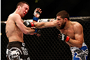 ANAHEIM, CA - FEBRUARY 23:  (R-L) Court McGee punches Josh Neer in their welterweight bout during UFC 157 at Honda Center on February 23, 2013 in Anaheim, California.  (Photo by Josh Hedges/Zuffa LLC/Zuffa LLC via Getty Images) *** Local Caption *** Court McGee; Josh Neer