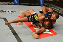 ANAHEIM, CA - FEBRUARY 23:  Ivan Menjivar (black shorts) slams Urijah Faber in their bantamweight bout during UFC 157 at Honda Center on February 23, 2013 in Anaheim, California.  (Photo by Donald Miralle/Zuffa LLC/Zuffa LLC via Getty Images) *** Local Caption *** Urijah Faber; Ivan Menjivar