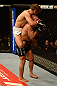 ANAHEIM, CA - FEBRUARY 23:  Urijah Faber (left) attempts to submit Ivan Menjivar in their bantamweight bout during UFC 157 at Honda Center on February 23, 2013 in Anaheim, California.  (Photo by Donald Miralle/Zuffa LLC/Zuffa LLC via Getty Images) *** Local Caption *** Urijah Faber; Ivan Menjivar
