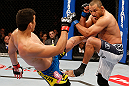 ANAHEIM, CA - FEBRUARY 23:  (L-R) Lyoto Machida kicks Dan Henderson in their light heavyweight bout during UFC 157 at Honda Center on February 23, 2013 in Anaheim, California.  (Photo by Josh Hedges/Zuffa LLC/Zuffa LLC via Getty Images) *** Local Caption *** Lyoto Machida; Dan Henderson