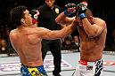 ANAHEIM, CA - FEBRUARY 23:  (L-R) Lyoto Machida punches Dan Henderson in their light heavyweight bout during UFC 157 at Honda Center on February 23, 2013 in Anaheim, California.  (Photo by Josh Hedges/Zuffa LLC/Zuffa LLC via Getty Images) *** Local Caption *** Lyoto Machida; Dan Henderson
