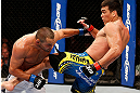 ANAHEIM, CA - FEBRUARY 23:  (R-L) Lyoto Machida kicks Dan Henderson in their light heavyweight bout during UFC 157 at Honda Center on February 23, 2013 in Anaheim, California.  (Photo by Josh Hedges/Zuffa LLC/Zuffa LLC via Getty Images) *** Local Caption *** Lyoto Machida; Dan Henderson