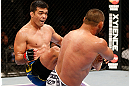 ANAHEIM, CA - FEBRUARY 23:  (L-R) Lyoto Machida kicks Dan Henderson in their light heavyweight bout during UFC 157 at Honda Center on February 23, 2013 in Anaheim, California.  (Photo by Josh Hedges/Zuffa LLC/Zuffa LLC via Getty Images) *** Local Caption *** Lyoto Machida; Dan Henderson