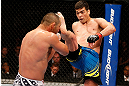 ANAHEIM, CA - FEBRUARY 23:  (R-L) Lyoto Machida kicks Dan Henderson in their light heavyweight bout during UFC 157 at Honda Center on February 23, 2013 in Anaheim, California.  (Photo by Josh Hedges/Zuffa LLC/Zuffa LLC via Getty Images) *** Local Caption *** Lyoto Machida; Dan Henderson
