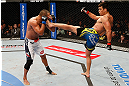 ANAHEIM, CA - FEBRUARY 23:  (R-L) Lyoto Machida kicks Dan Henderson in their light heavyweight bout during UFC 157 at Honda Center on February 23, 2013 in Anaheim, California.  (Photo by Josh Hedges/Zuffa LLC/Zuffa LLC via Getty Images) *** Local Caption *** Lyoto Machida; Dan Henderson