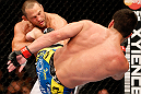 ANAHEIM, CA - FEBRUARY 23:  (R-L) Lyoto Machida kicks Dan Henderson in their light heavyweight bout during UFC 157 at Honda Center on February 23, 2013 in Anaheim, California.  (Photo by Josh Hedges/Zuffa LLC/Zuffa LLC via Getty Images) *** Local Caption *** Lyoto Machida; Dan Henderson