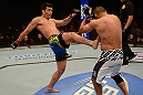 ANAHEIM, CA - FEBRUARY 23:  (L-R) Lyoto Machida kicks Dan Henderson in their light heavyweight bout during UFC 157 at Honda Center on February 23, 2013 in Anaheim, California.  (Photo by Donald Miralle/Zuffa LLC/Zuffa LLC via Getty Images) *** Local Caption *** Lyoto Machida; Dan Henderson