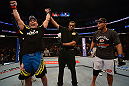ANAHEIM, CA - FEBRUARY 23:  Lyoto Machida (left) reacts to being declared the winner over Dan Henderson in their light heavyweight bout during UFC 157 at Honda Center on February 23, 2013 in Anaheim, California.  (Photo by Donald Miralle/Zuffa LLC/Zuffa LLC via Getty Images) *** Local Caption *** Lyoto Machida; Dan Henderson