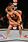 ANAHEIM, CA - FEBRUARY 23:  Liz Carmouche (top) attempts to submit Ronda Rousey in their women's bantamweight title fight during UFC 157 at Honda Center on February 23, 2013 in Anaheim, California.  (Photo by Josh Hedges/Zuffa LLC/Zuffa LLC via Getty Images) *** Local Caption *** Ronda Rousey; Liz Carmouche