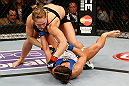 ANAHEIM, CA - FEBRUARY 23:  Ronda Rousey (top) punches Liz Carmouche in their women's bantamweight title fight during UFC 157 at Honda Center on February 23, 2013 in Anaheim, California.  (Photo by Josh Hedges/Zuffa LLC/Zuffa LLC via Getty Images) *** Local Caption *** Ronda Rousey; Liz Carmouche