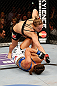 ANAHEIM, CA - FEBRUARY 23:  Ronda Rousey (top) punches Liz Carmouche in their women's bantamweight title fight during UFC 157 at Honda Center on February 23, 2013 in Anaheim, California.  (Photo by Josh Hedges/Zuffa LLC/Zuffa LLC via Getty Images) *** Local Caption *** Ronda Rousey; Liz Carmouche