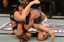 ANAHEIM, CA - FEBRUARY 23:  Ronda Rousey (left) attempts to submit Liz Carmouche in their women's bantamweight title fight during UFC 157 at Honda Center on February 23, 2013 in Anaheim, California.  (Photo by Donald Miralle/Zuffa LLC/Zuffa LLC via Getty Images) *** Local Caption *** Ronda Rousey; Liz Carmouche