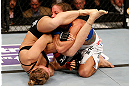 ANAHEIM, CA - FEBRUARY 23:  Ronda Rousey (left) attempts to submit Liz Carmouche in their women's bantamweight title fight during UFC 157 at Honda Center on February 23, 2013 in Anaheim, California.  (Photo by Josh Hedges/Zuffa LLC/Zuffa LLC via Getty Images) *** Local Caption *** Ronda Rousey; Liz Carmouche