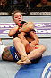 ANAHEIM, CA - FEBRUARY 23:  Ronda Rousey (top) attempts to submit Liz Carmouche in their women's bantamweight title fight during UFC 157 at Honda Center on February 23, 2013 in Anaheim, California.  (Photo by Josh Hedges/Zuffa LLC/Zuffa LLC via Getty Images) *** Local Caption *** Ronda Rousey; Liz Carmouche