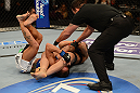 ANAHEIM, CA - FEBRUARY 23:  Ronda Rousey (center) attempts to submit Liz Carmouche in their women's bantamweight title fight during UFC 157 at Honda Center on February 23, 2013 in Anaheim, California.  (Photo by Donald Miralle/Zuffa LLC/Zuffa LLC via Getty Images) *** Local Caption *** Ronda Rousey; Liz Carmouche
