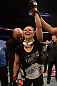 ANAHEIM, CA - FEBRUARY 23:  UFC President Dana White (rear) puts the UFC women's bantamweight title belt around Ronda Rousey after women's bantamweight title fight during UFC 157 at Honda Center on February 23, 2013 in Anaheim, California.  (Photo by Donald Miralle/Zuffa LLC/Zuffa LLC via Getty Images) *** Local Caption *** Ronda Rousey; Dana White