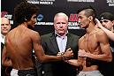 SAITAMA, JAPAN - MARCH 02: (L-R) Opponents Alex Caceres and Kyung Ho Kang face off during the UFC on FUEL TV weigh-in at Saitama Super Arena on March 2, 2013 in Saitama, Japan. (Photo by Josh Hedges/Zuffa LLC/Zuffa LLC via Getty Images)